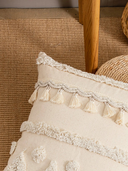 A beige triangular dot tassel pillow cover with European and American style tufting